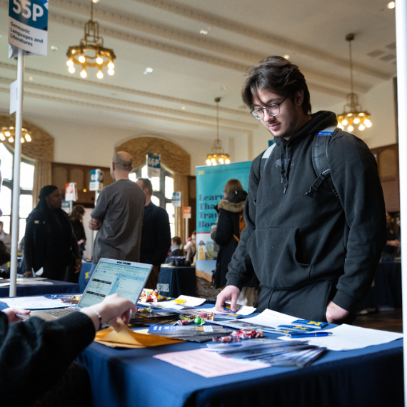 Student at Expo looking for more information.